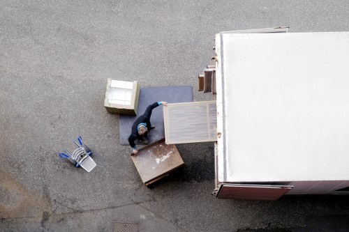 Local moving team packing fragile household items near Pratts Bottom