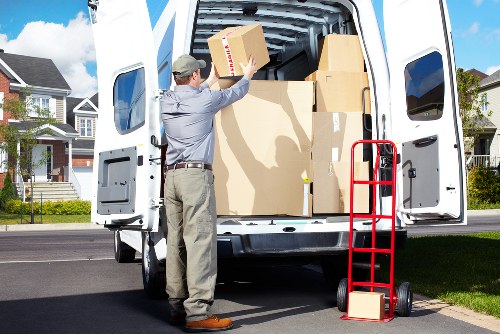 Professional movers loading items for a Pratts Bottom relocation