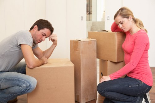Professional movers handling furniture during a house removal