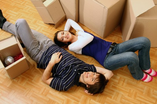 Professional movers protecting furniture during a home removal