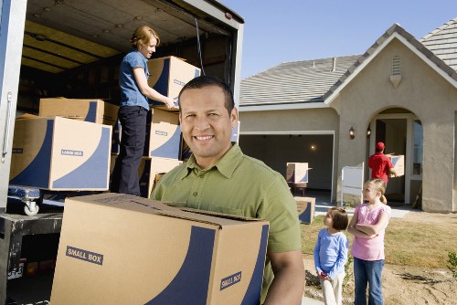 Packed boxes and furniture prepared for a house removal service